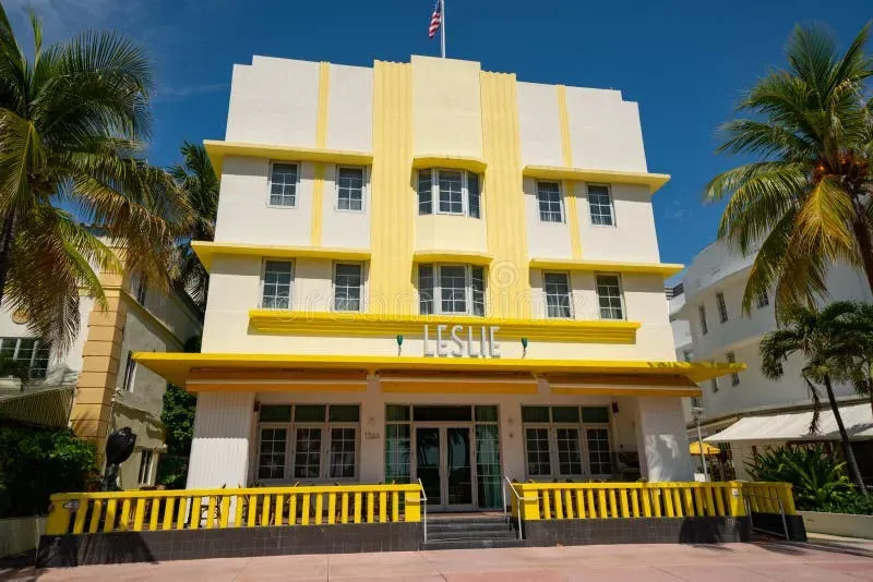 Yellow and white facade of The Leslie Hotel, a classic 1937 Art Deco boutique hotel on Ocean Drive in Miami Beach