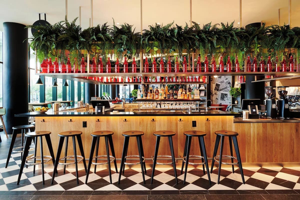 Café and bar at CitizenM Miami Worldcenter with coffee service and work-friendly social spaces for digital nomads and remote workers.
