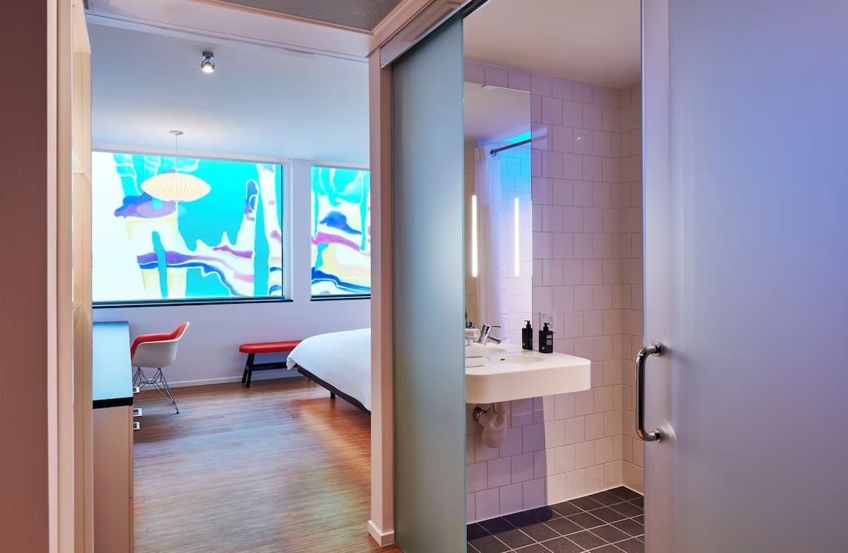 In-room workspace at CitizenM Miami Worldcenter with a real desk, comfortable chair, strong lighting, and a quiet design for digital nomads