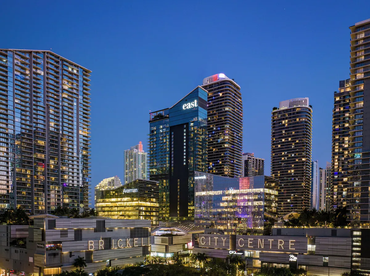 Brickell City Centre at night with EAST Miami hotel tower, the best luxury hotel in Brickell for first-time visitors, located in the most walkable part of downtown Miami.
