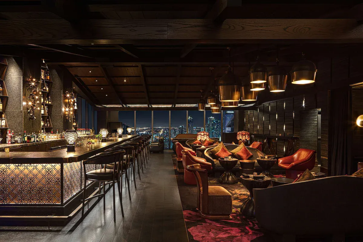 Upscale cocktail lounge at Sugar rooftop bar inside EAST Miami in Brickell, featuring skyline night views, lounge seating, and elegant nightlife without South Beach chaos.