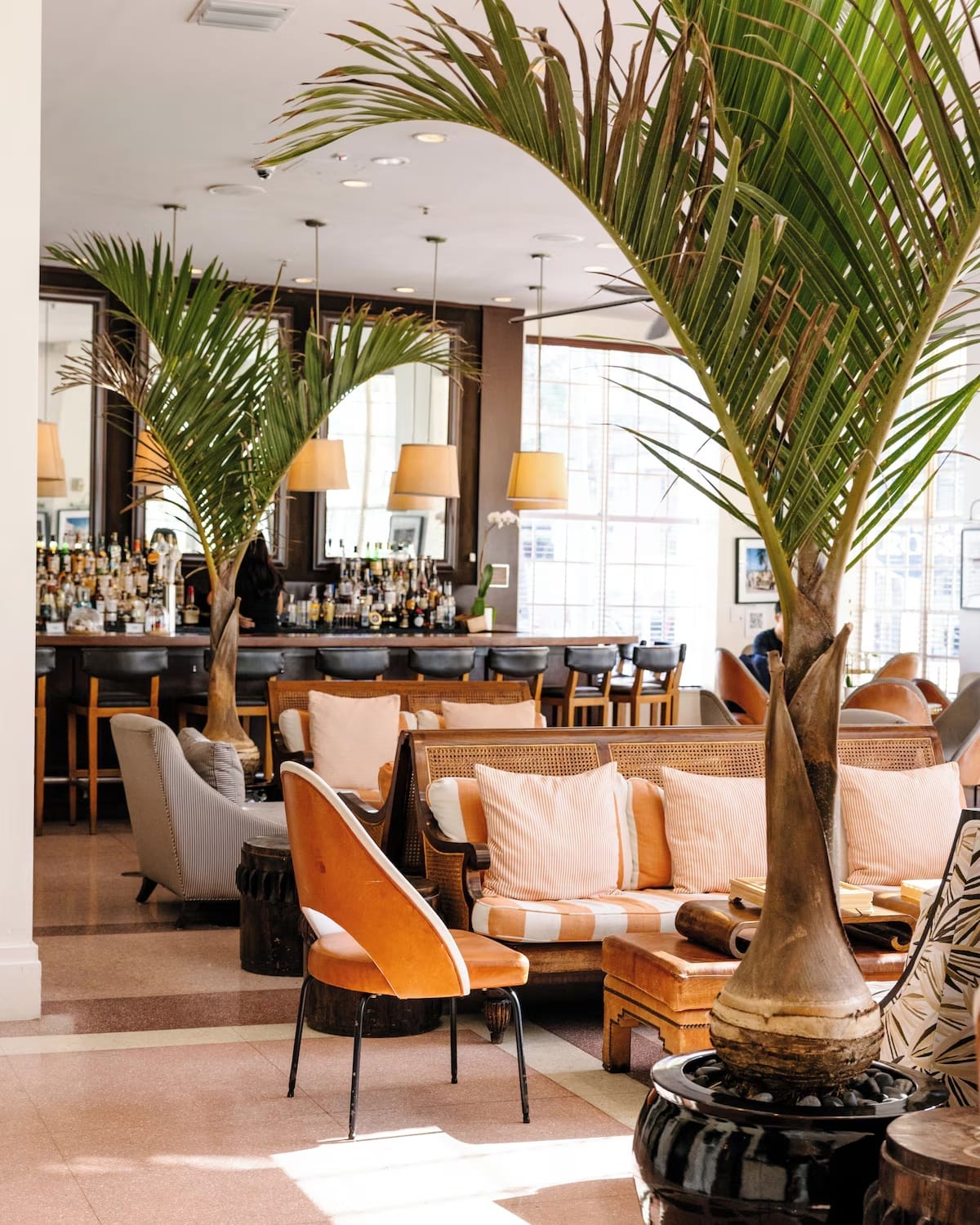 The Betsy Hotel lobby bar and dining area in South Beach — on-site breakfast, cocktails, and restaurant convenience for guests.