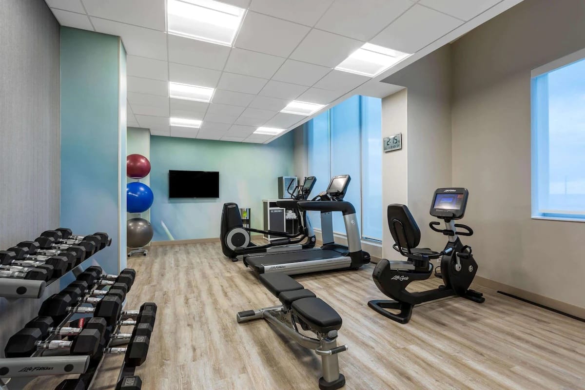 24-hour fitness center at Wyndham Garden Miami International Airport with cardio and strength equipment.
