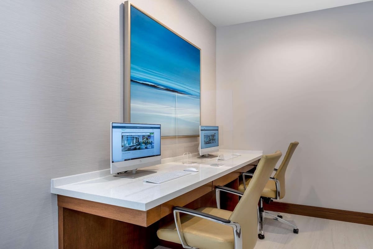 Business center at Wyndham Garden Miami International Airport with computer stations for business and early-flight travelers.