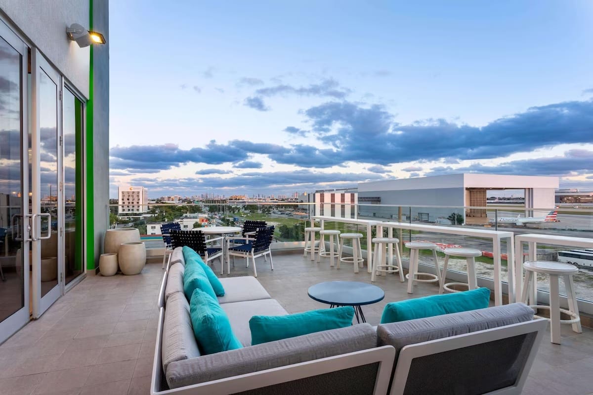 Outdoor lounge and seating area at Wyndham Garden Miami International Airport with views near Miami International Airport.