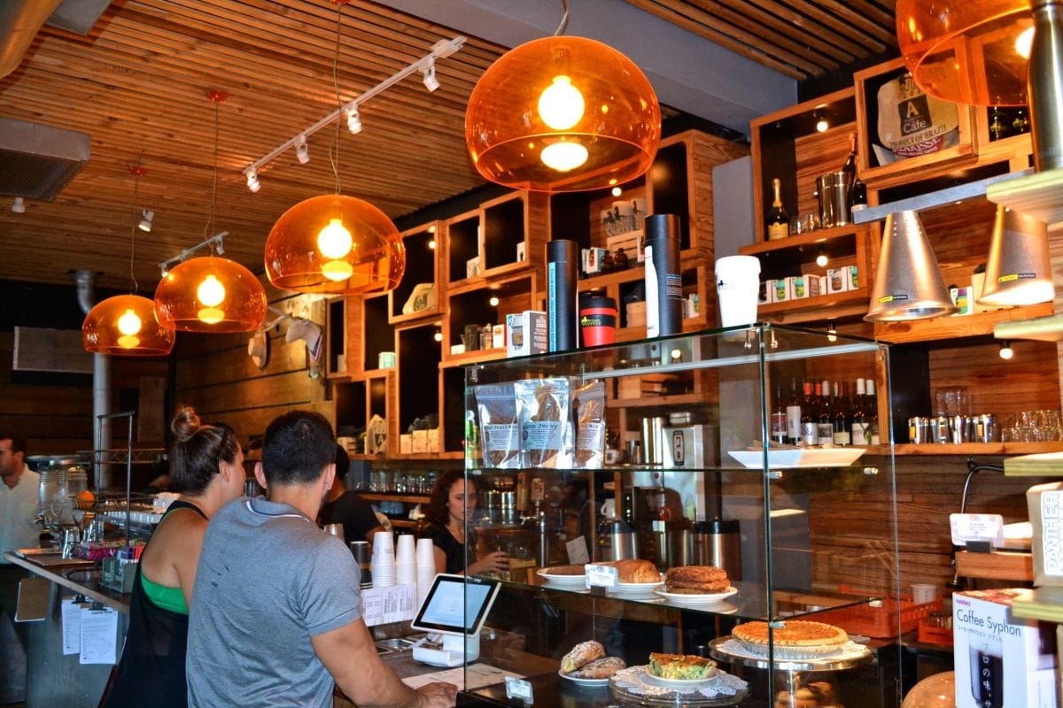 Panther Coffee cafe interior in Wynwood Miami specialty coffee shop with baristas pastries and craft espresso drinks