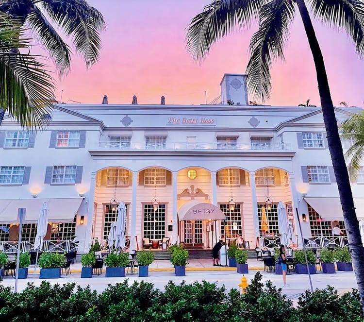 The Betsy Hotel exterior on Ocean Drive in South Beach at sunset, Miami Beach Florida — best hotel for first-time visitors.