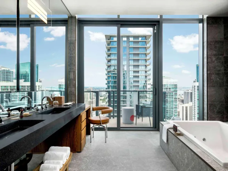Luxury suite at EAST Miami, the best luxury hotel in Brickell for first-time visitors, featuring skyline views, modern design, and a private balcony in downtown Miami.